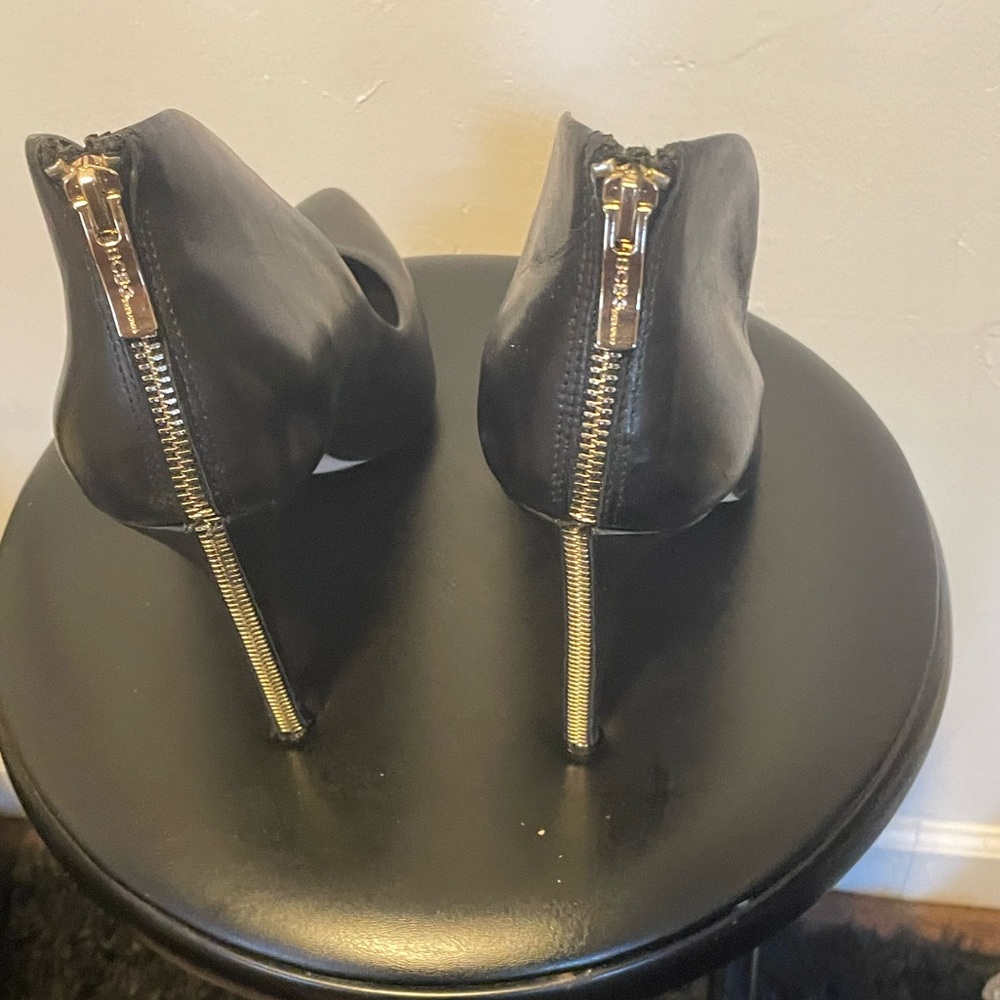 Black pumps with gold zipper. BCBG Generation size 11.